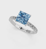 Platinum Fancy Blue Princess Cut Diamond Solitaire Pavé Band with Four-Prong Setting