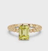 Yellow gold Fancy Yellow Emerald Cut Diamond Solitaire Ring with Beaded Band and Prong Setting
