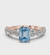 Rose gold Fancy Blue Emerald Cut Diamond Prong Setting with Side Stones on a Pave Band