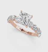 Rose gold Princess Cut Diamond Prong Setting with Side Stones on a Pave Band