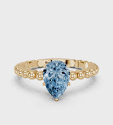 Yellow gold Fancy Blue Pear Cut Diamond Solitaire Ring with Beaded Band and Prong Setting