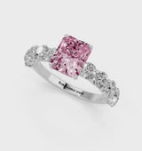 White gold Fancy Pink Radiant Cut Diamond Prong Setting with Side Stones on a Pave Band