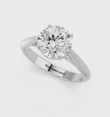 White gold Round Cut Diamond Solitaire Engagement Ring with Cathedral Setting and Four-Prong Mount