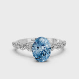 White gold Fancy Blue Oval Cut Solitaire Diamond Ring with Pave Band and Four-Prong Setting