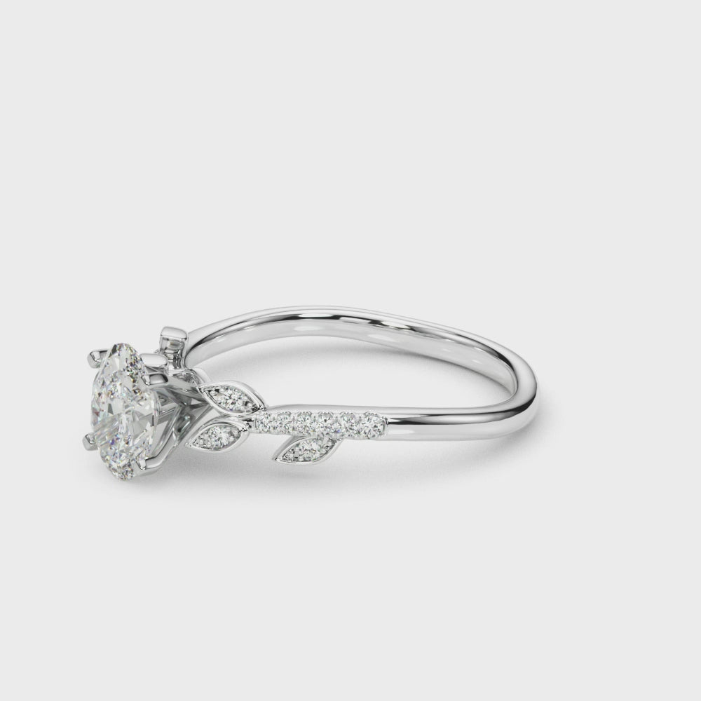 Silver Oval Solitaire Leaf-Inspired Diamond Ring with Pavé Band and Four-Prong Setting 3