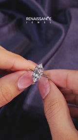 Platinum Marquise Cut Diamond Solitaire Ring with Flower Prong Setting and Classic Band