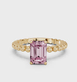 Yellow gold Fancy Pink Emerald Cut Diamond Solitaire Ring with Beaded Band and Prong Setting