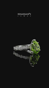 Silver Pear Cut Peridot Side Stone Solitaire Ring with Round and Four-Prong Setting