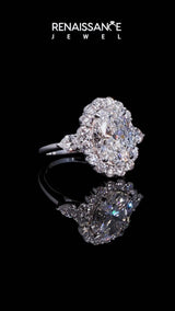 Silver Emerald Cut Diamond Halo Ring with Pear Side Stones and Prong Setting