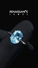 Silver Oval Cut Blue Topaz Solitaire Engagement Ring with Classic Band and Four-Prong Setting