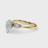 Yellow gold Three-Stone Pear Cut Diamond Ring with Pear Side Stones and Four-Prong Setting