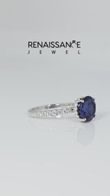 Silver Round Cut Blue Sapphire Solitaire Ring with Round  Pavé Band and Four-Prong Setting