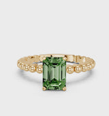 Yellow gold Fancy Green Emerald Cut Diamond Solitaire Ring with Beaded Band and Prong Setting