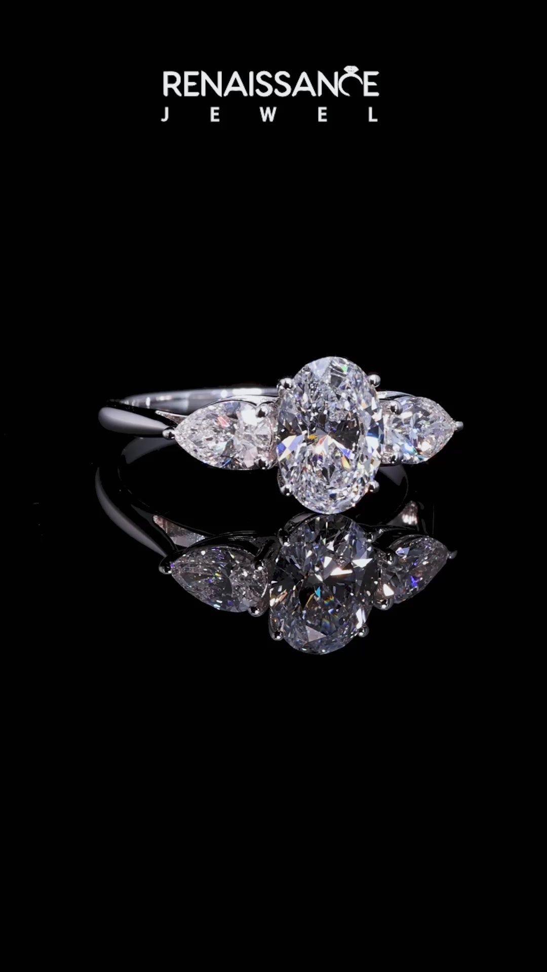 White gold Three-Stone Oval Diamond Solitaire Ring with Pear Side Stones and Four-Prong Setting_33