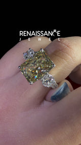 White gold Fancy Yellow Radiant  Cut Diamond Three-Stone Ring with Round Side Stones and Pavé Band