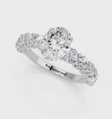 Silver Oval Cut Diamond Prong Setting with Side Stones on a Pave Band