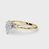 Yellow gold Three-Stone Pear Cut Diamond Solitaire with Prong Setting and Classic Band