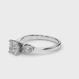 White gold Three-Stone Cushion Cut Diamond Ring with Pear Side Stones and Four-Prong Setting