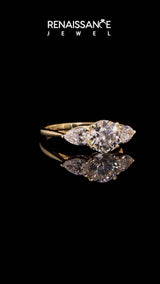 Yellow gold Three-Stone Pear Cut Brilliant Diamond Solitaire Ring with Tapered Band and Four-Prong Setting