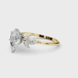 Yellow gold Pear Diamond Floral Cluster Ring with Marquise Side Stones and Six-Prong Solitaire Setting