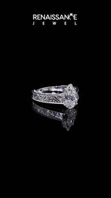 White gold Pear Cut Diamond Solitaire Ring with Engraved Band and Four-Prong Setting