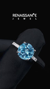 Silver Round Cut Blue Topaz Solitaire Ring with Round  Pavé Band and Four-Prong Setting