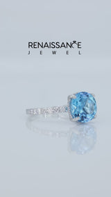 Silver Round Cut Blue Topaz Solitaire Ring with Round  Pavé Band and Four-Prong Setting