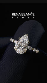 Yellow gold Pear Cut Diamond Ring with Marquise and Round  Side Stones and Four-Prong Setting