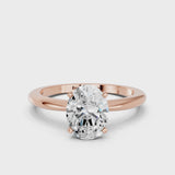 Rose gold Oval Cut Diamond Solitaire Ring with Six-Prong Setting and Classic Band