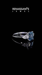 Silver Three-Stone Fancy Blue Emerald Cut Diamond Ring with Pear  Side Stones in Four-Prong Setting