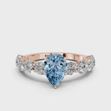 Rose gold Fancy Blue Pear Cut Diamond Prong Setting with Side Stones on a Pave Band