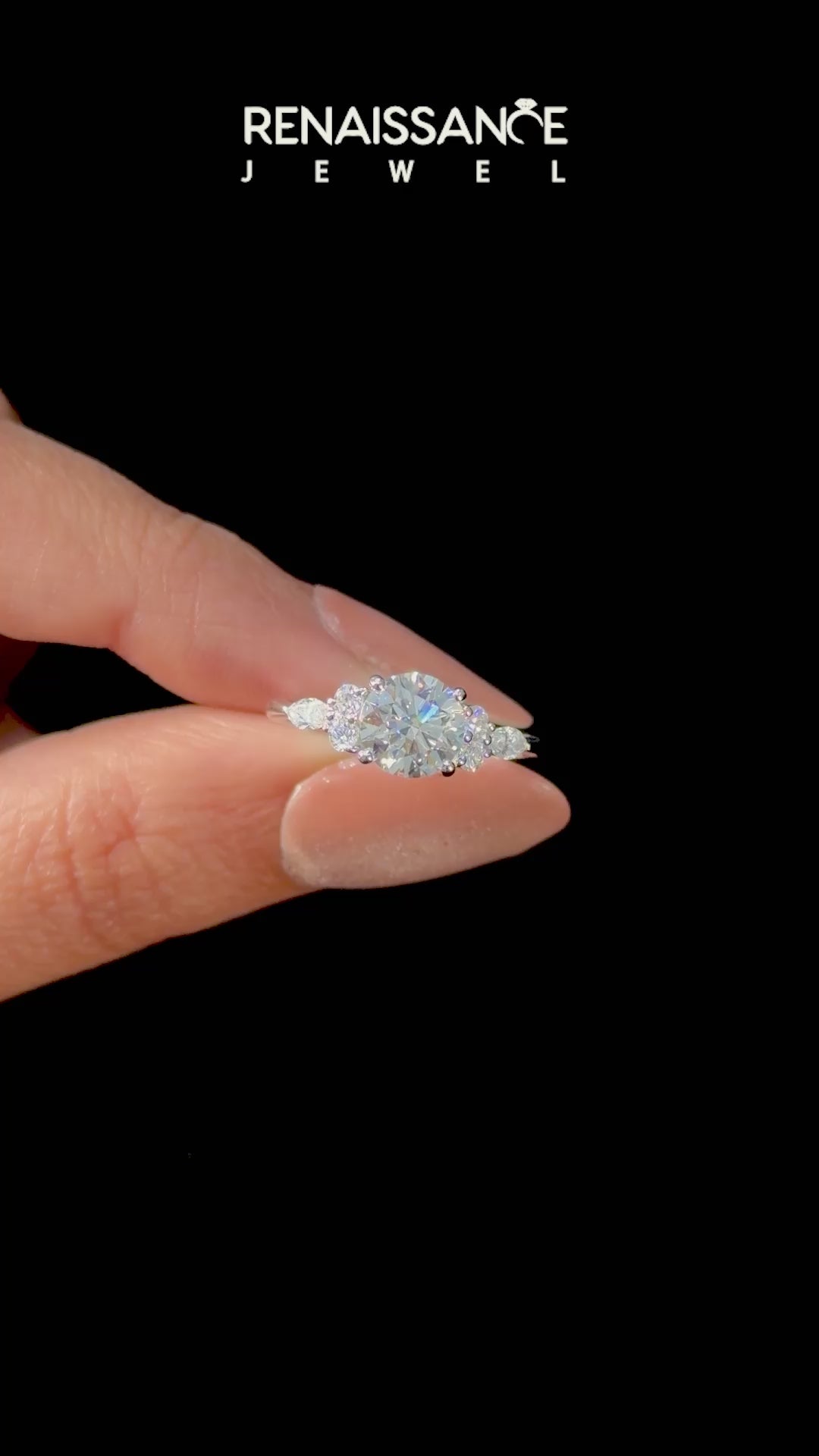 Silver Round Brilliant Diamond Solitaire Ring with Pear Side Stones and Four-Prong Setting_25