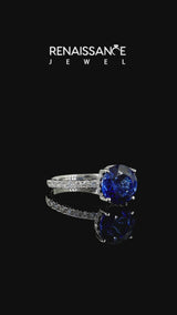 Silver Round Cut Blue Sapphire Solitaire Ring with Round  Pavé Band and Four-Prong Setting