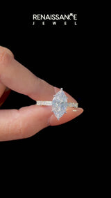 Yellow gold Marquise Cut Diamond Solitaire with Side Baguettes and Channel Set Band