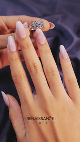 White gold Three-Stone Emerald Cut Cut Diamond Ring with Trillion Side Stones and Four-Prong Setting
