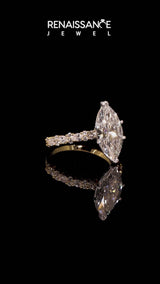 Yellow gold Marquise Cut Diamond Side Stone Solitaire Ring with Round  and Four-Prong Setting