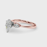 Rose gold Three-Stone Pear Cut Diamond Ring with Pear Side Stones and Four-Prong Setting