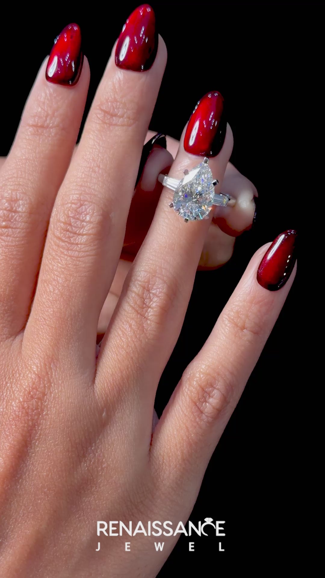 White gold Pear Solitaire with Tapered Baguette Side Stones on a Classic Band with Six-Prong Setting_32