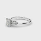 White gold Three-Stone Emerald Cut Diamond Ring with Pear Side Stones and Four-Prong Setting