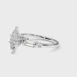 White gold Marquise Cut Diamond Ring with Baguette Side Stones, Channel Set Band, and Four-Prong Setting
