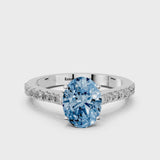 White gold Fancy Blue Oval  Cut Solitaire Diamond Engagement Ring with Pave Band and Four-Prong Setting
