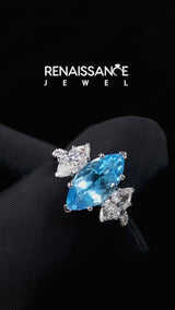 Silver Three-Stone Marquise Cut Blue Topaz Ring with Round  Pavé Band and Prong Setting