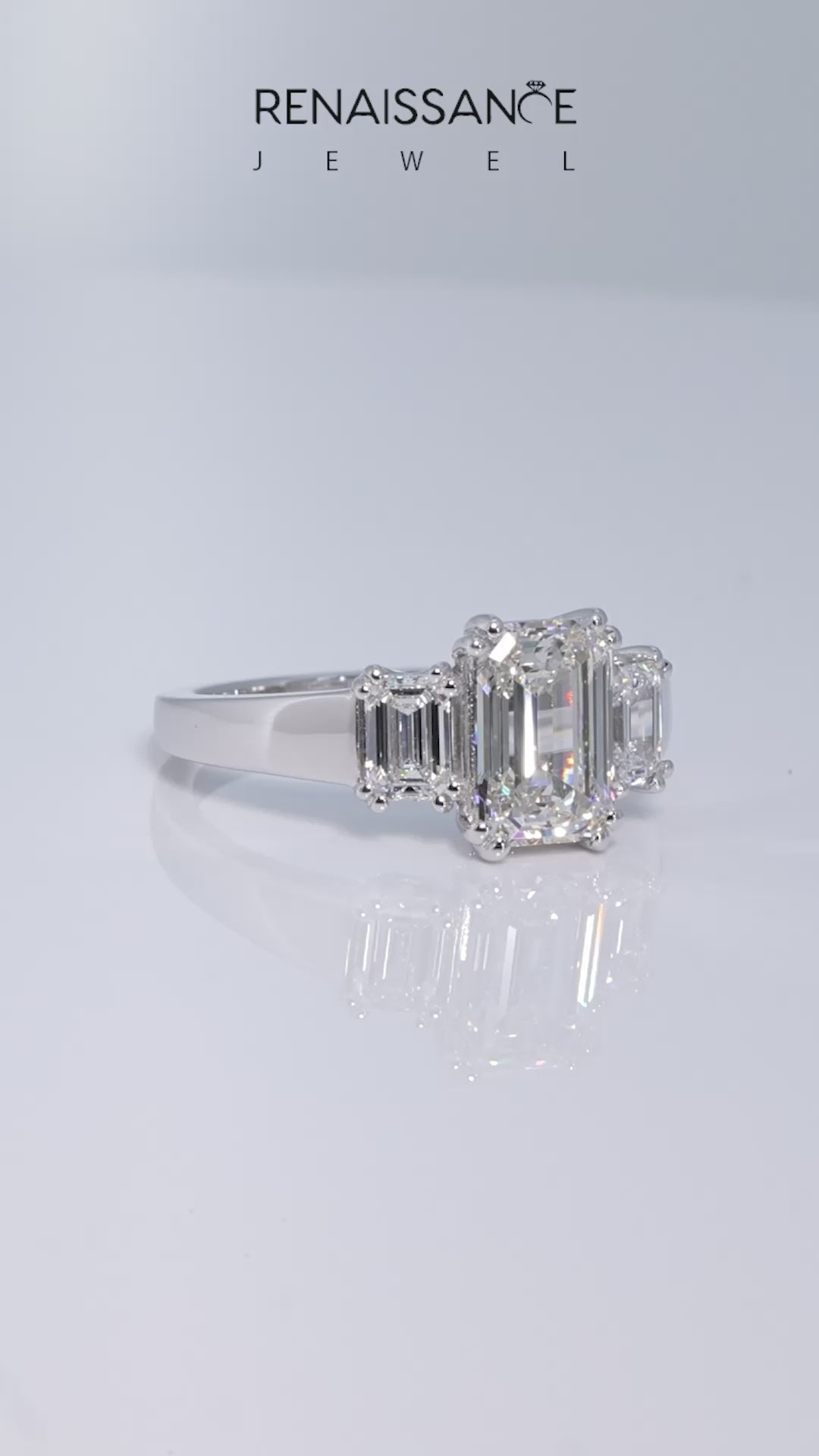 White gold Three-Stone Emerald Cut Diamond Ring with Channel Set Band and Four-Prong Setting_5