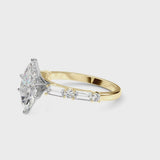 Yellow gold Marquise Cut Diamond Solitaire with Side Baguettes and Channel Set Band