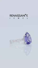 Silver Pear Cut Tanzanite Side Stone Solitaire Ring with Round and Four-Prong Setting