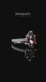 Silver Pear Cut Garnet Side Stone Solitaire Ring with Round and Four-Prong Setting