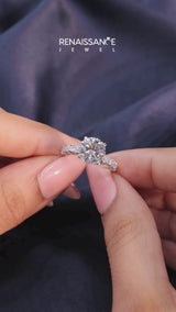 Platinum Round Cut Diamond Side Stone Solitaire Ring with Round  and Four-Prong Setting