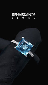 Silver Princess Cut Blue Topaz Solitaire Ring with Round  Pavé Band and Prong Setting