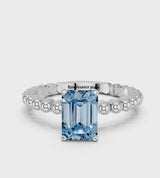 White gold Fancy Blue Emerald Cut Diamond Solitaire Ring with Beaded Band and Prong Setting
