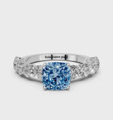 White gold Fancy Blue Cushion Cut Diamond Prong Setting with Side Stones on a Pave Band